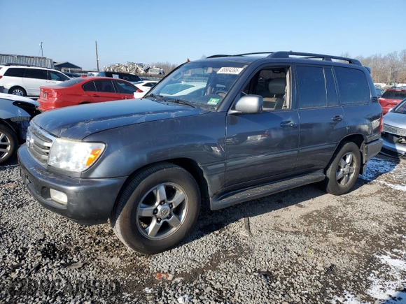 2006 Toyota Land Cruiser z VIN JTEHT05J362082746, wystawiony jako Copart lot #88804395 z przebiegiem 262 952 mil mil oraz Tytuł czysty. Historia ofert i sprzedaży dostępna na DreamBid. Obrazek 1.