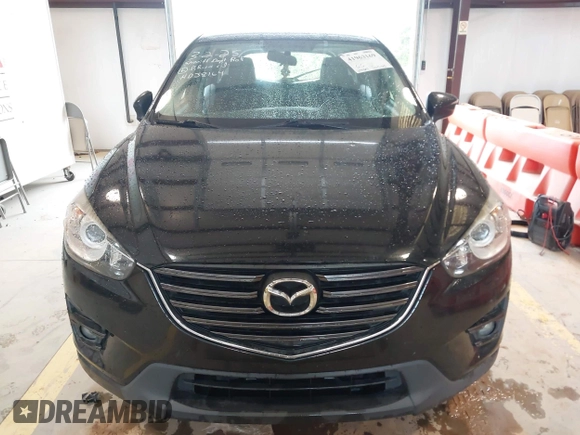 2016 Mazda CX-5 Touring with VIN JM3KE2CY7G0867355, listed as a IAAI auction lot 41963169 with 117,727 mi miles and . Bid and sale history available at DreamBid. Image 12.