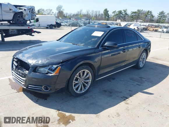 2011 Audi A8 with VIN WAUAVAFD5BN022388, listed as a IAAI auction lot 42102765 with 141,865 mi miles and . Bid and sale history available at DreamBid. Image 2.