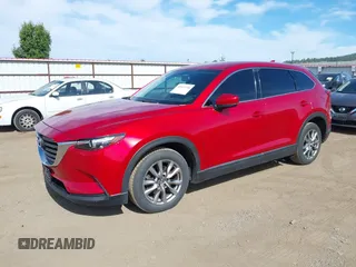 2016 Mazda CX-9 Touring z VIN JM3TCACY9G0122174, wystawiony jako IAAI lot #42613740 z przebiegiem 148 646 mil mil oraz . Historia ofert i sprzedaży dostępna na DreamBid. Obrazek 2.