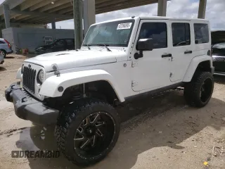 2015 Jeep Wrangler Unlimited Wrangler X with VIN 1C4BJWEG6FL614671, listed as a Copart auction lot 62286095 with 94,928 mi miles and Salvage title. Bid and sale history available at DreamBid. Image 1.