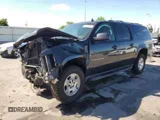 2013 Chevrolet Suburban LT with VIN 1GNSKJE70DR138631, listed as a Copart auction lot 57778185 with 176,934 mi miles and Salvage title. Bid and sale history available at DreamBid. Image 1.