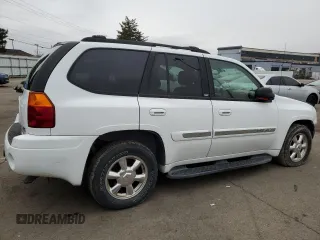 2003 GMC Envoy SLT with VIN 1GKDT13S332293112, listed as a Copart auction lot 43721225 with 139,471 mi miles and Salvage Title. Bid and sale history available at carsss.com. Image 3.