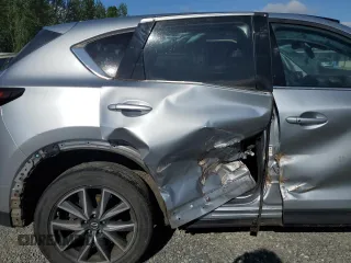 2018 Mazda CX-5 Grand Touring с VIN JM3KFBDM5J0323923, выставлен на аукционе Copart как лот 58162435 с пробегом 144 792 миль миль и Списание • Salvage title. История ставок и продаж доступна на DreamBid. Изображение 11.