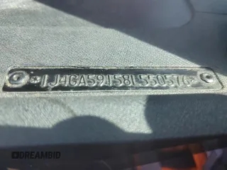 2008 Jeep Wrangler Unlimited Sahara with VIN 1J4GA59158L550576, listed as a Copart auction lot 53095565 with 208,434 mi miles and Salvage Title. Bid and sale history available at DreamBid. Image 12.