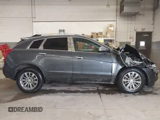 2013 Cadillac SRX Performance Collection with VIN 3GYFNHE37DS530908, listed as a IAAI auction lot 41662796 with 80,254 mi miles. Bid and sale history available at carsss.com. Image 14.
