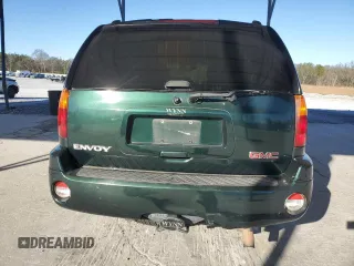2004 GMC Envoy SLT z VIN 1GKDS13S942127830, wystawiony jako Copart lot #87165024 z przebiegiem 172 592 mil mil oraz Szkoda całkowita • Salvage title. Historia ofert i sprzedaży dostępna na DreamBid. Obrazek 6.