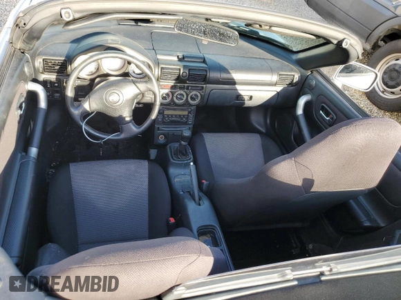 2001 Toyota MR2 z VIN JTDFR320410036287, wystawiony jako Copart lot #73851984 z przebiegiem Nie podano mil oraz Szkody całkowita. Historia ofert i sprzedaży dostępna na DreamBid. Obrazek 8.