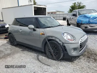 2014 MINI Hardtop with VIN WMWXM5C51ET934047, listed as a Copart auction lot 63039335 with 104,446 mi miles and Salvage title. Bid and sale history available at DreamBid. Image 4.