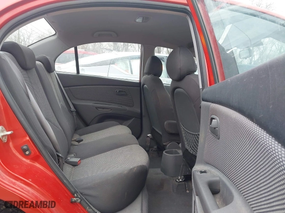 2009 Kia Rio SX with VIN KNADE223796561406, listed as a IAAI auction lot 41650749 with 100,041 mi miles. Bid and sale history available at carsss.com. Image 8.