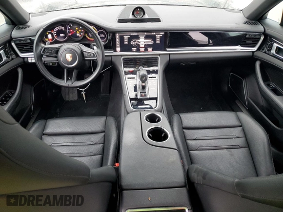 2021 Porsche Panamera с VIN WP0AJ2A75ML120017, выставлен на аукционе Copart как лот 81517913 с пробегом 26 083 миль миль и . История ставок и продаж доступна на DreamBid. Изображение 8.