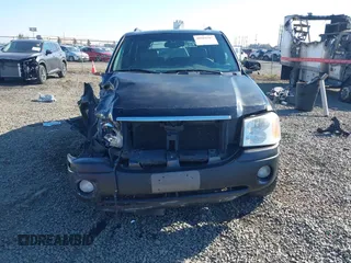 2002 GMC Envoy SLT z VIN 1GKDT13S522146661, wystawiony jako IAAI lot #40502587 z przebiegiem 274 877 mil mil oraz . Historia ofert i sprzedaży dostępna na DreamBid. Obrazek 13.