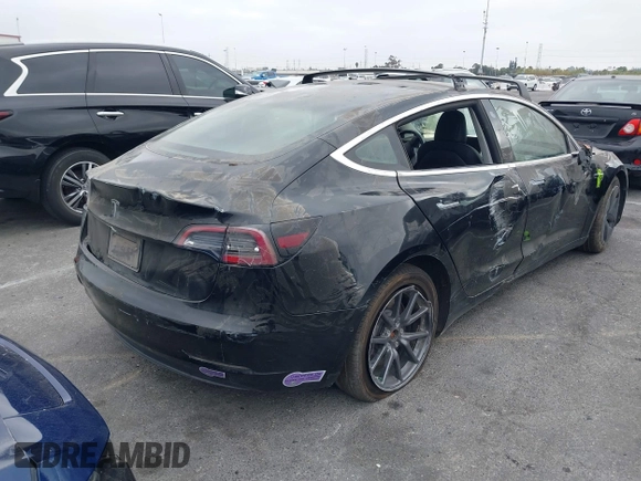 2019 Tesla Model 3 Mid Range with VIN 5YJ3E1EA2KF362048, listed as a IAAI auction lot 40141734 with 70,321 mi miles and . Bid and sale history available at carsss.com. Image 4.
