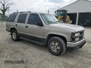 1999 Chevrolet Tahoe Z71 with VIN 1GNEK13R6XJ301562, listed as a Copart auction lot 59684595 with 200,561 mi miles and Salvage title. Bid and sale history available at DreamBid. Image 4.