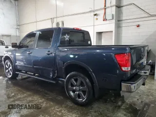2015 Nissan Titan SL with VIN 1N6AA0EC1FN509625, listed as a Copart auction lot 41700575 with 100,327 mi miles and Salvage Title. Bid and sale history available at carsss.com. Image 2.
