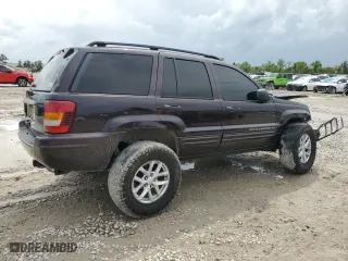 2004 Jeep Grand Cherokee Laredo with VIN 1J4GX48S44C150571, listed as a Copart auction lot 51013675 with 260,986 mi miles and Salvage Title. Bid and sale history available at carsss.com. Image 3.