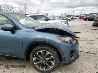 2016 Mazda CX-5 Grand Touring z VIN JM3KE4DY2G0637779, wystawiony jako Copart lot #52001805 z przebiegiem 184 381 mil mil oraz Czysty tytuł • Clean title. Historia ofert i sprzedaży dostępna na DreamBid. Obrazek 14.
