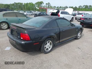 2000 Ford Mustang with VIN 1FAFP4048YF163834, listed as a IAAI auction lot 42090407 with 161,928 mi miles. Bid and sale history available at carsss.com. Image 4.