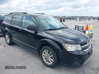 2015 Dodge Journey SXT with VIN 3C4PDCBG5FT604847, listed as a IAAI auction lot 42108853 with 164,679 mi miles. Bid and sale history available at carsss.com. Image 1.