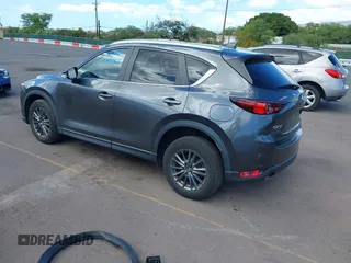 2021 Mazda CX-5 Touring with VIN JM3KFACM2M1348305, listed as a IAAI auction lot 41627199 with 30,044 mi miles. Bid and sale history available at carsss.com. Image 3.