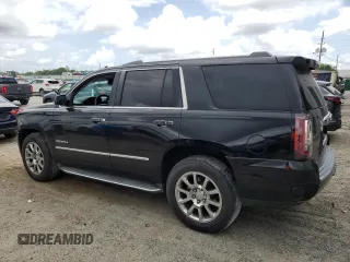 2015 GMC Yukon Denali with VIN 1GKS1CKJ0FR140877, listed as a Copart auction lot 50917985 with 180,726 mi miles and Salvage Title. Bid and sale history available at carsss.com. Image 2.