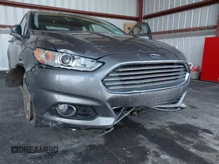 2013 Ford Fusion Titanium Hybrid with VIN 3FA6P0RU0DR277092, listed as a IAAI auction lot 41811079 with 123,071 mi miles. Bid and sale history available at carsss.com. Image 6.