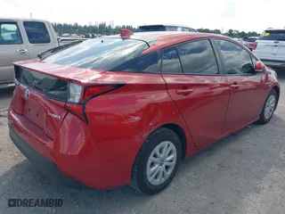 2021 Toyota Prius L Eco with VIN JTDKAMFU6M3148195, listed as a IAAI auction lot 41801369 with 130,601 mi miles. Bid and sale history available at carsss.com. Image 4.