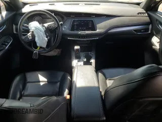 2019 Cadillac XT4 FWD Premium Luxury with VIN 1GYFZCR42KF104457, listed as a Copart auction lot 52783485 with 57,572 mi miles and Salvage title. Bid and sale history available at DreamBid. Image 8.