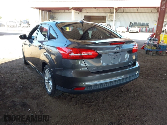2015 Ford Focus SE z VIN 1FADP3F21FL210742, wystawiony jako IAAI lot #42418476 z przebiegiem 155 829 mil mil oraz . Historia ofert i sprzedaży dostępna na DreamBid. Obrazek 3.