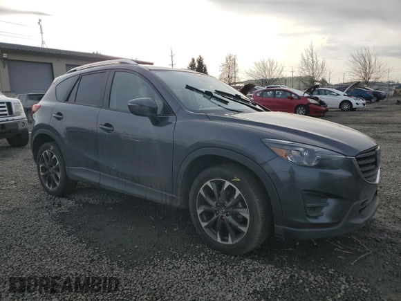 2016 Mazda CX-5 Grand Touring with VIN JM3KE4DY0G0876540, listed as a Copart auction lot 42132815 with 110,158 mi miles and Salvage Title. Bid and sale history available at DreamBid. Image 4.