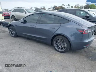 2023 Tesla Model 3 with VIN 5YJ3E1EA4PF410060, listed as a IAAI auction lot 42067624 with 59,934 mi miles and . Bid and sale history available at DreamBid. Image 3.