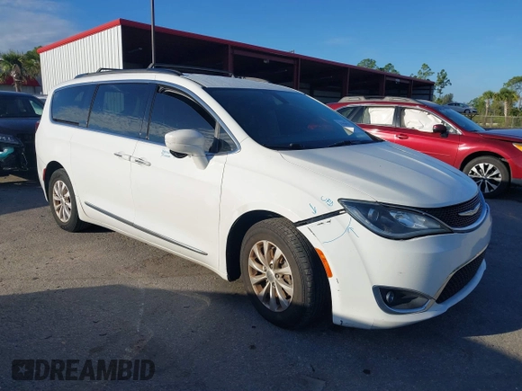 2017 Chrysler Pacifica Touring L with VIN 2C4RC1BG2HR526503, listed as a IAAI auction lot 40264571 with 136,262 mi miles and . Bid and sale history available at DreamBid. Image 1.