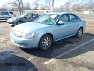 2008 Ford Taurus SEL with VIN 1FAHP27WX8G157077, listed as a IAAI auction lot 41499882 with 113,039 mi miles. Bid and sale history available at carsss.com. Image 2.