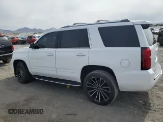 2018 Chevrolet Tahoe Premier with VIN 1GNSKCKC6JR195246, listed as a Copart auction lot 54887165 with 135,973 mi miles and Salvage title. Bid and sale history available at DreamBid. Image 2.