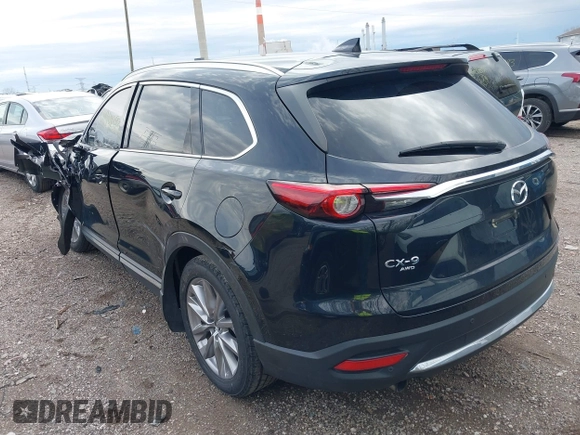 2020 Mazda CX-9 Grand Touring with VIN JM3TCBDY3L0419049, listed as a IAAI auction lot 41948393 with 70,163 mi miles and . Bid and sale history available at DreamBid. Image 3.
