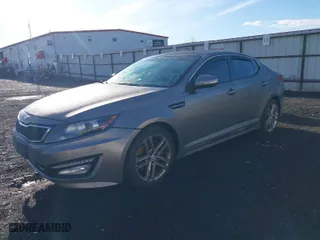 2013 Kia Optima SX w/Limited Pkg with VIN 5XXGR4A67DG191290, listed as a IAAI auction lot 41864684 with 136,525 mi miles. Bid and sale history available at carsss.com. Image 2.