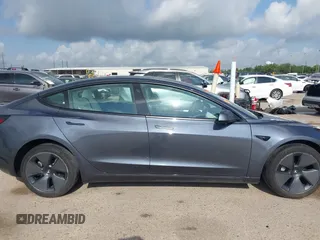2023 Tesla Model 3 with VIN 5YJ3E1EA7PF567906, listed as a IAAI auction lot 42280993 with 41,452 mi miles and . Bid and sale history available at DreamBid. Image 14.