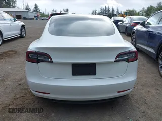2020 Tesla Model 3 Standard Range Plus with VIN 5YJ3E1EA5LF613002, listed as a IAAI auction lot 42129085 with 55,672 mi miles. Bid and sale history available at carsss.com. Image 17.