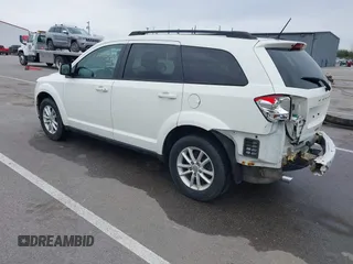2013 Dodge Journey SXT with VIN 3C4PDCBG9DT564303, listed as a IAAI auction lot 41954764 with 132,125 mi miles. Bid and sale history available at carsss.com. Image 3.