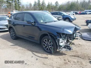 2018 Mazda CX-5 Touring z VIN JM3KFBCM4J0379871, wystawiony jako IAAI lot #41865130 z przebiegiem 48 674 mil mil oraz . Historia ofert i sprzedaży dostępna na DreamBid. Obrazek 1.