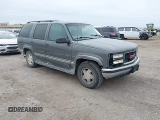 1999 GMC Yukon with VIN 1GKEK13R0XJ803237, listed as a IAAI auction lot 41736117 with 295,793 mi miles. Bid and sale history available at carsss.com. Image 1.