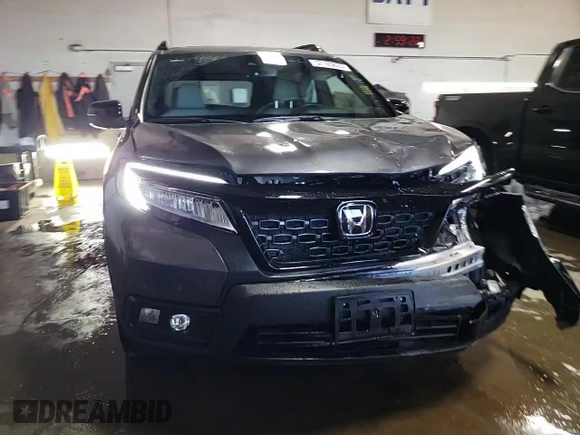 2021 Honda Passport Touring with VIN 5FNYF8H98MB012326, listed as a Copart auction lot 52165835 with 21,679 mi miles and Salvage Title. Bid and sale history available at carsss.com. Image 13.