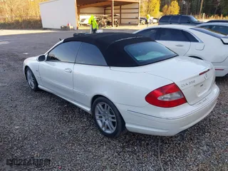 2009 Mercedes-Benz CLK-Class 3.5L with VIN WDBTK56F89T106562, listed as a IAAI auction lot 41313426 with 161,578 mi miles. Bid and sale history available at carsss.com. Image 3.