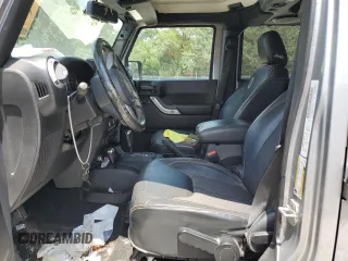2013 Jeep Wrangler Unlimited Sport with VIN 1C4BJWDG4DL628518, listed as a Copart auction lot 65029795 with 142,852 mi miles and Salvage title. Bid and sale history available at DreamBid. Image 7.