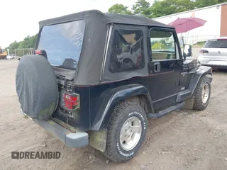2001 Jeep Wrangler Sahara with VIN 1J4FA59S41P358035, listed as a IAAI auction lot 42685488 with 120,630 mi miles and . Bid and sale history available at DreamBid. Image 4.