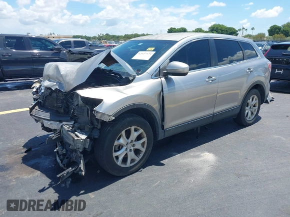 2011 Mazda CX-9 Sport with VIN JM3TB2BA3B0308508, listed as a IAAI auction lot 42517371 with 139,986 mi miles and . Bid and sale history available at DreamBid. Image 2.