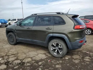2015 Jeep Cherokee Trailhawk with VIN 1C4PJMBSXFW545534, listed as a Copart auction lot 62236885 with 148,448 mi miles and Clean title. Bid and sale history available at DreamBid. Image 2.