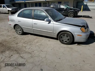 2005 Hyundai Accent GLS with VIN KMHCG45C75U638812, listed as a Copart auction lot 77968234 with 130,815 mi miles and Salvage Title. Bid and sale history available at carsss.com. Image 4.