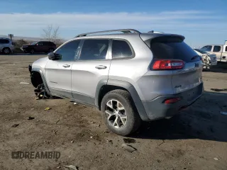 2018 Jeep Cherokee Trailhawk with VIN 1C4PJMBB9JD571773, listed as a Copart auction lot 82876514 with 137,565 mi miles and Salvage title. Bid and sale history available at DreamBid. Image 2.