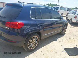 2012 Volkswagen Tiguan SE with VIN WVGAV7AX7CW534703, listed as a IAAI auction lot 42463358 with 119,699 mi miles and . Bid and sale history available at DreamBid. Image 4.